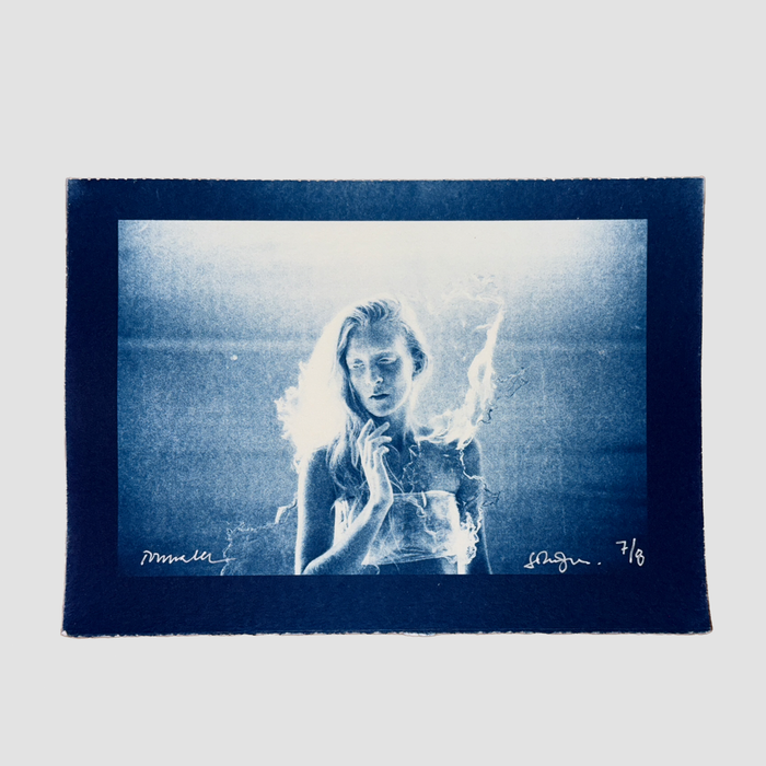 Cyanotype depicting a portrait of ionnalee in front of a lake, by John Strandh